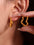 18K gold-plated stainless steel heart earrings with bead and rhinestone design.