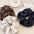 3-piece PU leather elastic hair scrunchy set in brown, black, and beige.