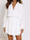 Ruffled notched balloon sleeve mini dress in white with buttoned front and layered skirt.