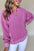 Notched drop shoulder long sleeve sweatshirt in pink, featuring basic style and slightly stretchy fabric.