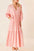 Frill tiered tie neck long sleeve dress in pink cotton fabric.