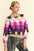 Davi & Dani Checkered Round Neck Long Sleeve Sweater in pink and purple tones worn by a model.