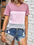 Color block round neck short sleeve t-shirt with pink, lavender, and gray sections, paired with denim shorts.