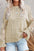 Openwork round neck long sleeve sweater in beige with intricate knit design.