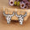 Alloy Animal Print Cow Head EarringsMyMooiaTrendsiPieces: 1-pair
Material: Alloy, PU
Care instructions: Avoid wearing during exercise, as sweat will react with the jewelry to produce silver chloride and copper sulfiAlloy Animal Print Cow Head Earrings