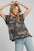 Umgee ruffled landscape print short sleeve French terry top.