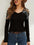 Rhinestone cutout long sleeve black T-shirt with slight stretch, worn with jeans and belt.