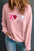 Valentine’s Day XOXO round neck long sleeve sweatshirt with sequin detail.