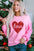 Pink LOVE heart sequin dropped shoulder sweatshirt with textured sleeves.