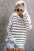 Striped round neck drop shoulder sweater in black and white, slightly stretchy, 100% acrylic.