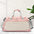 Oxford cloth travel bag with multiple pockets and adjustable strap, featuring oversize design in pink and beige tones.