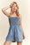 ADORA smocked spaghetti strap denim romper with smocked bodice and pockets.