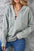 Lace up long sleeve hoodie in light gray with slightly stretchy fabric.