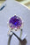 5 Carat Moissanite 925 Sterling Silver Ring with purple stone in platinum-plated setting.