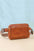 Medium PU leather rectangle crossbody bag with zipper, adjustable strap, and front pocket.