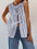 Tied striped round neck tank with three front bows, sleeveless design, and blue and white stripes.