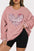 Plus size pink sweatshirt with heart sequin design and round neck.