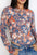 Floral round neck long sleeve t-shirt with vibrant floral print.