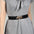 Alloy Buckle Elastic Belt on gray dress, PU material, 23.6-inch length, 2.4-inch width.