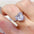 5 carat 925 sterling silver moissanite heart shape ring on finger.