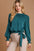 Umgee Frill Tied Hem Long Sleeve Blouse with ruffled design and belted bottom.