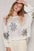 POL Flower Dropped Shoulder Long Sleeve Knit Top with floral pattern and dropped shoulders.