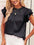 Leopard frill mock neck ruffled cap sleeve top in black polyester fabric.