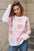 Angel Wings Heart Round Neck Long Sleeve Sweater with pink heart pattern and moderate stretch.