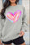 Valentine’s Day heart round neck drop shoulder sweatshirt, featuring a colorful heart design.