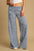 Umgee elastic waist wide leg pants in blue, featuring a comfortable ribbed texture and flowy silhouette.