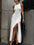 Side slit round neck sleeveless dress in white with moderate stretch.