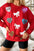 Valentine’s Day red sweatshirt with sequin bow and heart patterns, round neck.