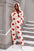 Fuzzy Heart Zip Up Hooded Lounge Jumpsuit with red heart pattern, opaque, 100% polyester.