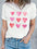 Heart round neck short sleeve t-shirt with pink heart design, slightly stretchy polyester.