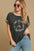 Umgee Peace Applique Round Neck French Terry Top with peace sign detail worn by model.