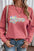 Valentine's Day LOVE round neck long sleeve sweatshirt with sequin detail.