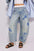 Contrast Star Wide Leg Jeans with blue star pattern, pocketed design, rayon and polyester blend.