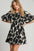 Two tone abstract print puff sleeve dress with a feminine silhouette and trendy design.