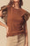 Ruffled round neck cap sleeve blouse in brown, featuring sheer ruffled sleeves and a slightly stretchy fabric.