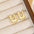 18K Gold-Plated Bubble Letter Stud EarringsMyMooiaTrendsiPieces: 1-pair
Material: 18K gold-plated, Copper
Care instructions: Avoid wearing during exercise, as sweat will react with the jewelry to produce silver chloride an18K Gold-Plated Bubble Letter Stud Earrings