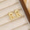 18K Gold-Plated Bubble Letter Stud EarringsMyMooiaTrendsiPieces: 1-pair
Material: 18K gold-plated, Copper
Care instructions: Avoid wearing during exercise, as sweat will react with the jewelry to produce silver chloride an18K Gold-Plated Bubble Letter Stud Earrings