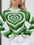 Heart Mock Neck Long Sleeve Sweater in green with geometric heart pattern, slightly stretchy polyester.