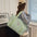 Oxford Cloth Oversize Travel Bag in mint green held by person indoors.