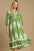 Umgee Printed Notched Midi Dress in green with white patterns, featuring a notched neckline and ruffled details.