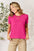 Basic Bae full size round neck short sleeve pink t-shirt worn by a woman indoors.