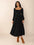 Square neck long sleeve midi dress with lace-up detail and ruched design in black.