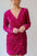 Sequin surplice long sleeve mini dress in vibrant pink with ruching detail.