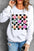 Valentine's Day checkered heart long sleeve sweatshirt with colorful heart designs.