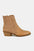 Beige point toe boots with studded details and low heels, made of PU leather.