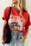 Red COWBOY round neck short sleeve t-shirt with graphic print.